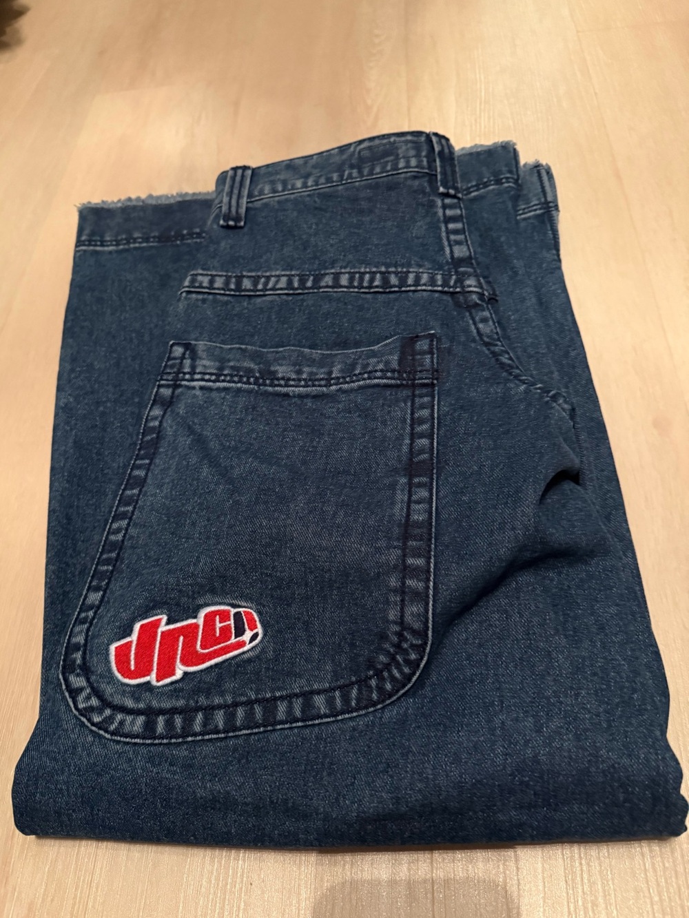 JNCO Dark Blue Flared Jeans with Red Logo Patch